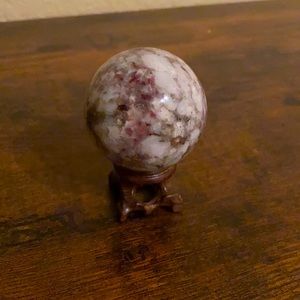 Red tourmaline quartz crystal ball with stand